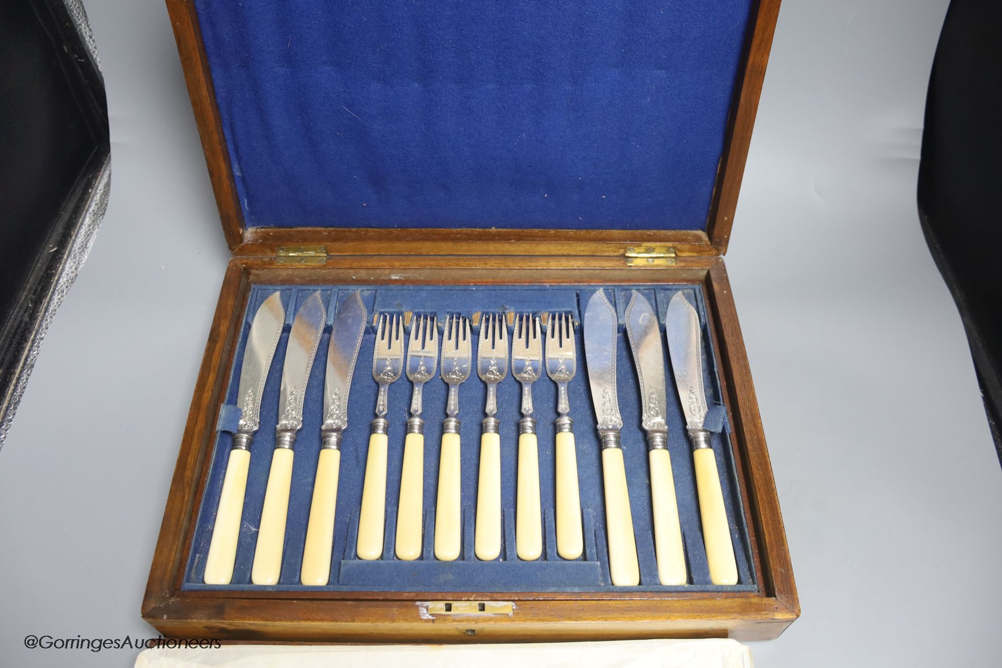 A Victorian cased set of eighteen pairs of ivory handled engraved silver fish eaters by John Gilbert & Co, Birmingham, 1874/5